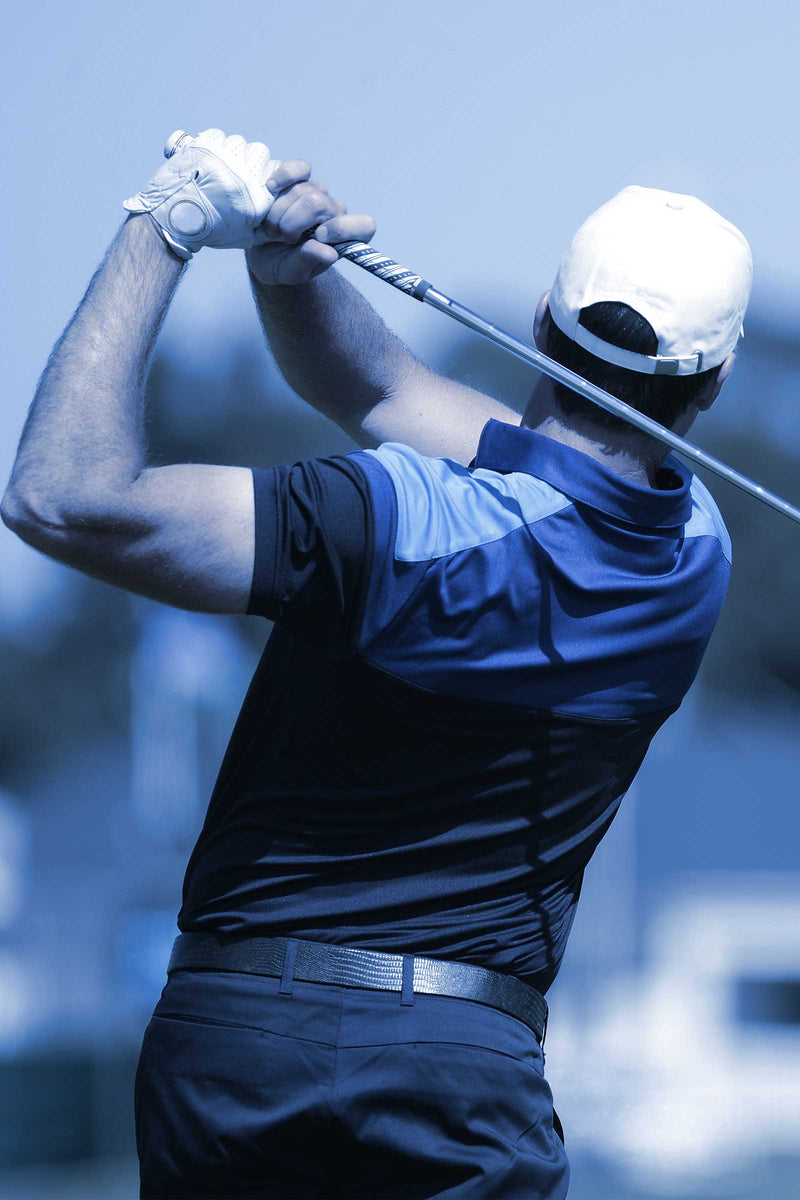 Golfer mid-swing