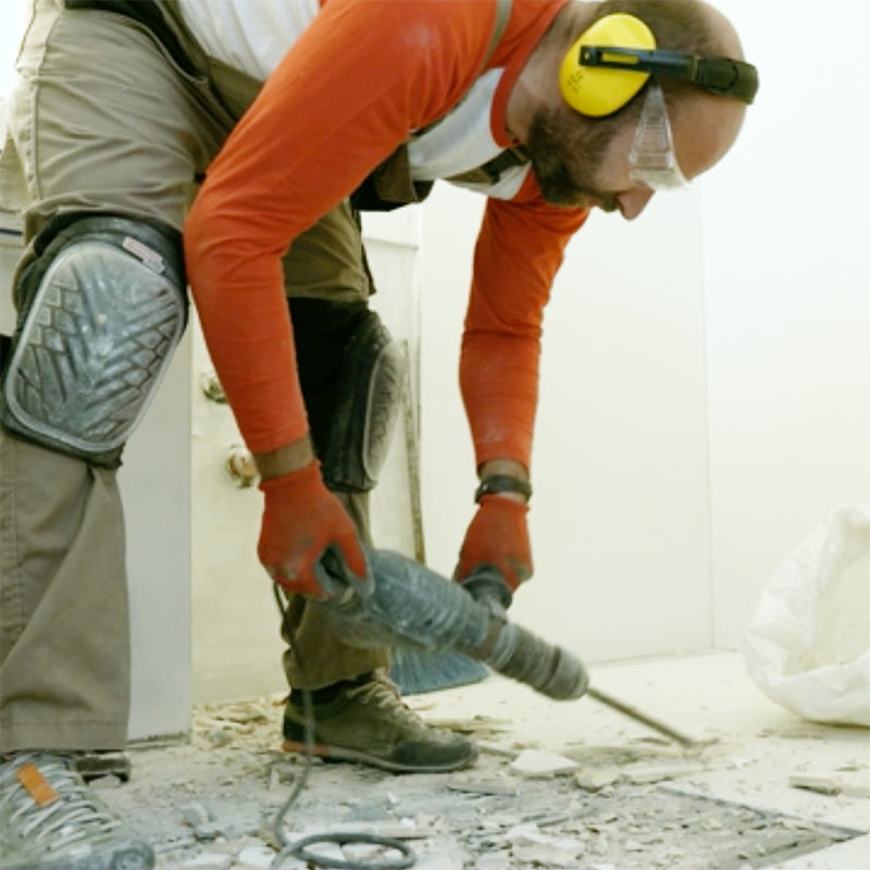 Construction worker running a jackhammer
